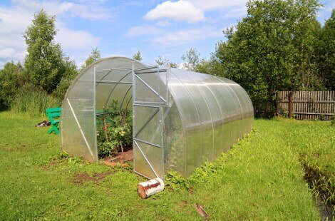Plastic hoop house in a garden during the summer